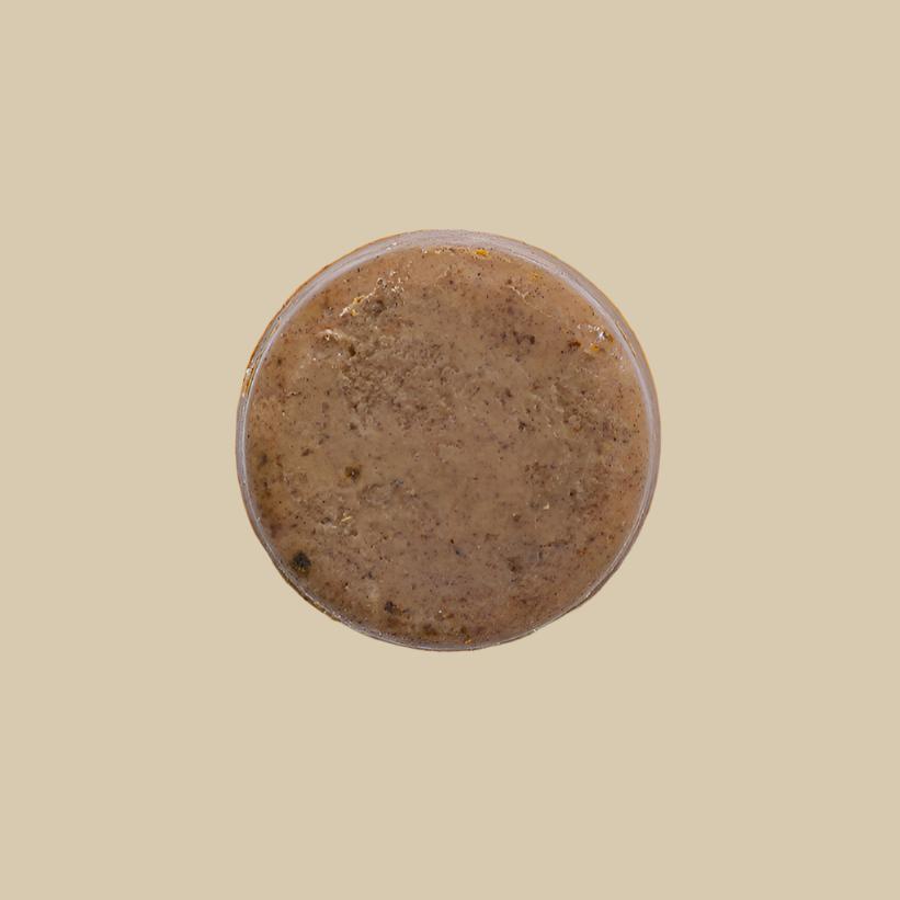Jabón Corporal y Facial de Renovador con fondo plano color cafe claro