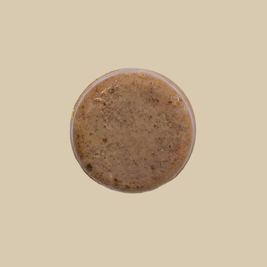 Jabón Corporal y Facial de Renovador con fondo plano color cafe claro