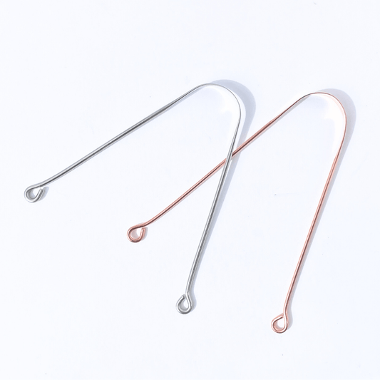 Raspador de Lengua de cobre y de acero inoxidable juntos con fondo blanco