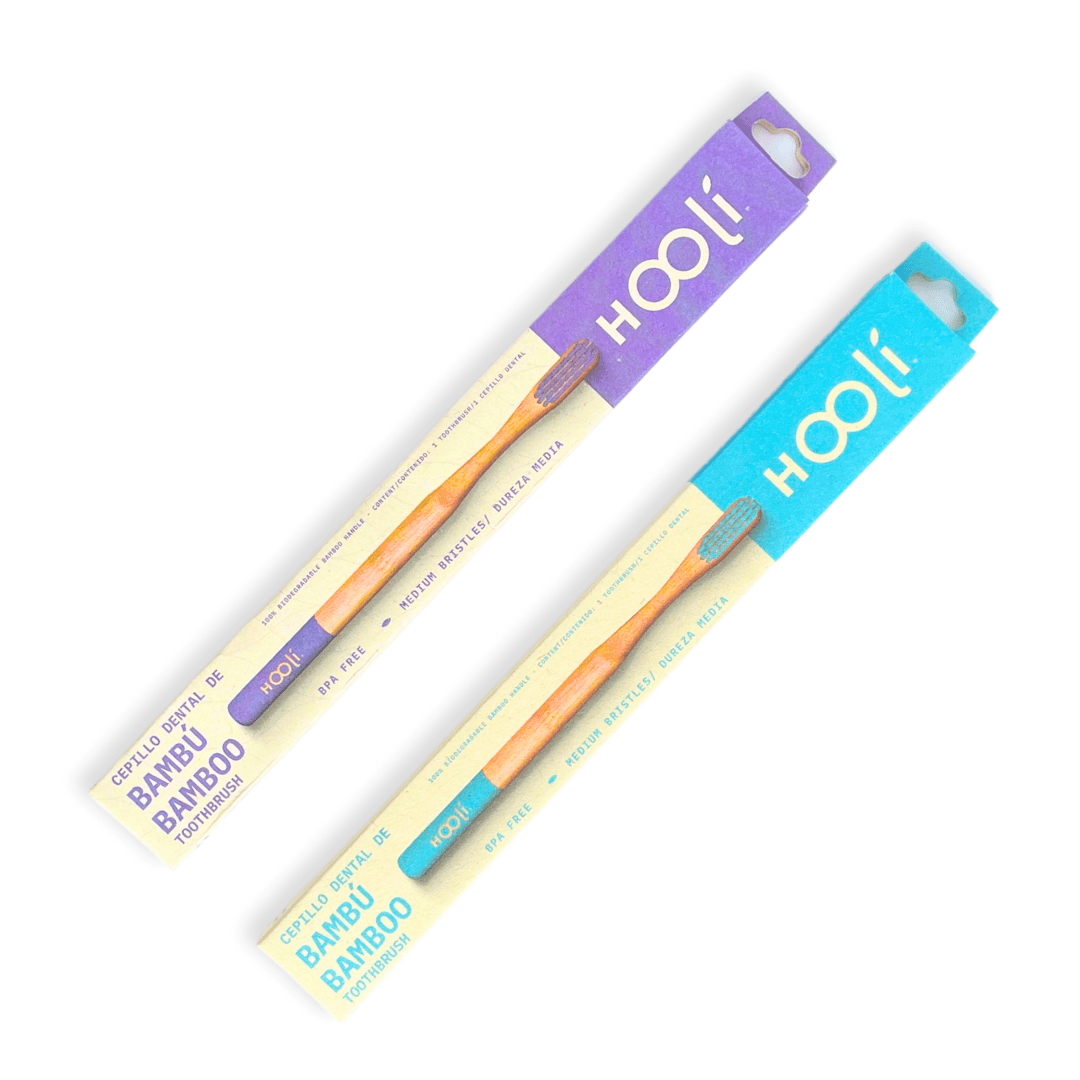 los dos opciones de colores de cepillos de dientes de hooli en su caja con fondo blanco