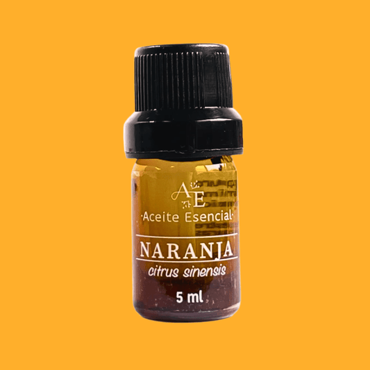 Aceite esencial de naranja de Ananda con fondo plano color naranja